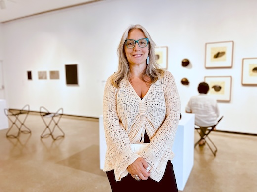 woman standing in gallery